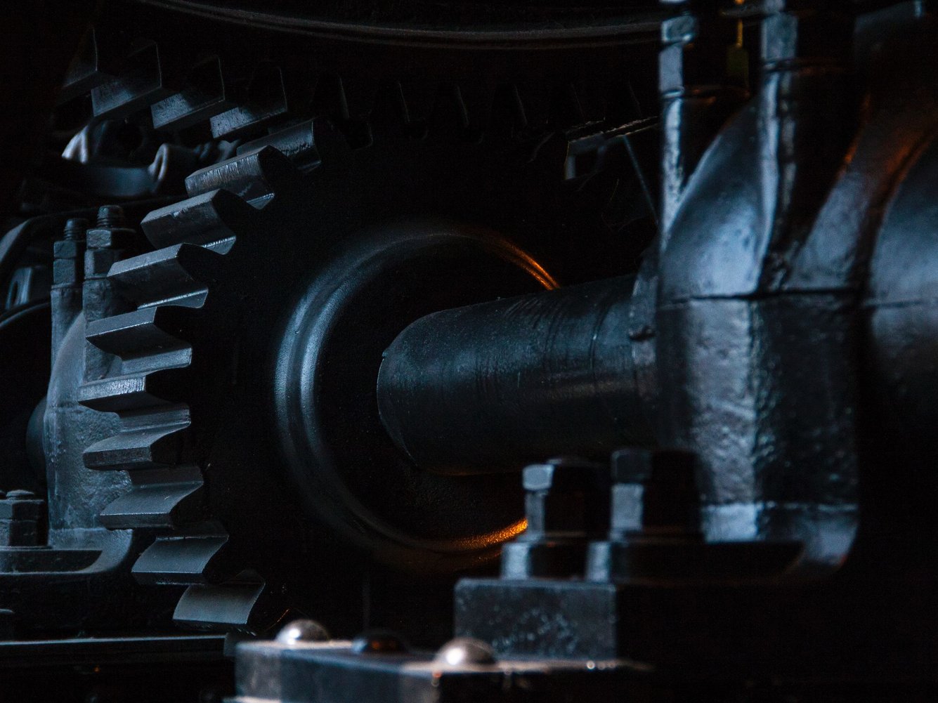 close-up photography of black metal gears