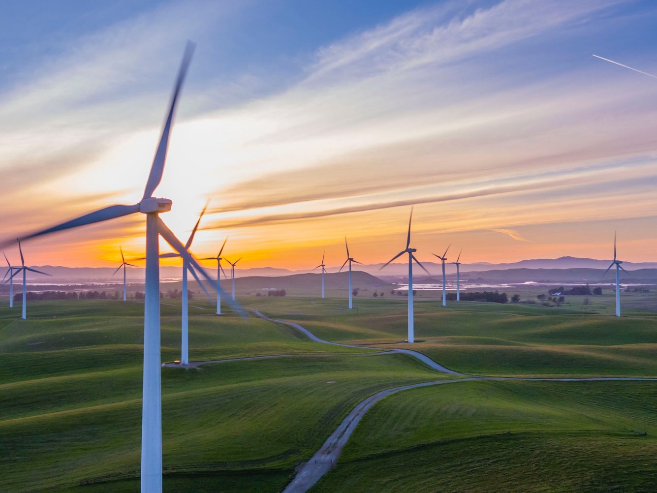 white wind mill lot on green field